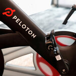 Peloton, struggling to sell its gear, reports a $1.2 billion loss.